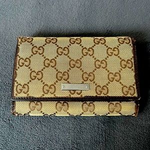 Authentic Gucci monogram snap wallet